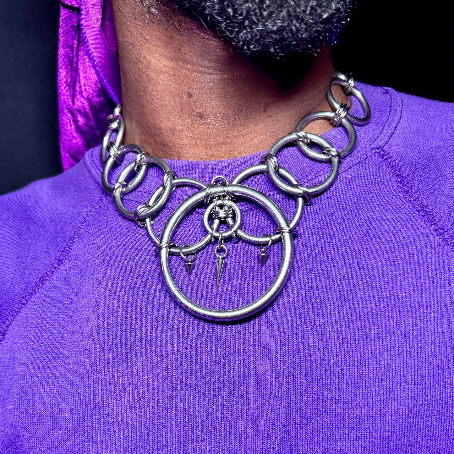 Stainless steel body harness necklace featuring bold chains and spiked accents, designed for all genders