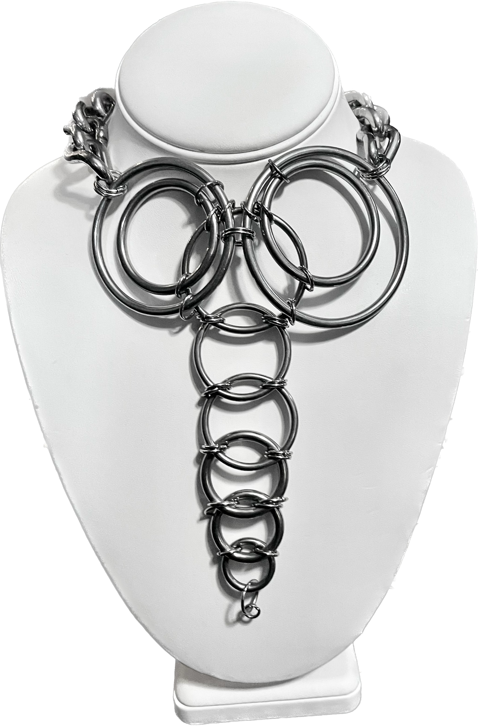 This stainless steel necklace features bold, interlocking rings that form a geometric pattern cascading down the chest. The chunky chain gives it a modern industrial edge, making it a striking statement piece perfect for standing out and embracing a daring style.